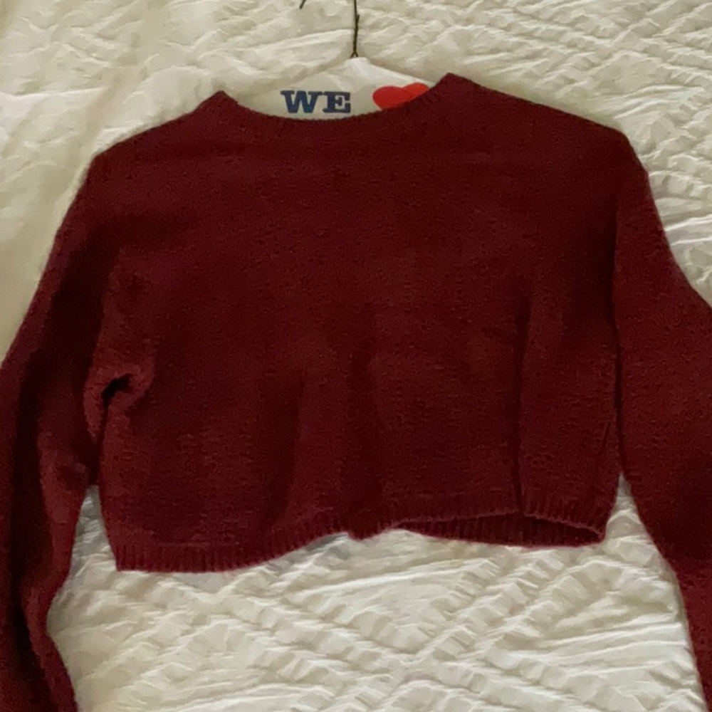The is a woman’s size, XS and is a red sweater